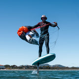Person on a hydrofoil board in the water showing pack away of ozone pocket rocket v2